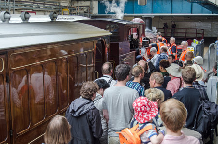 London, UK - June 22, 2019: Crowds admiring the last steam train to use the District Line to arrive at Ealing Broadway Station.  The special event marked the 150th anniverary of the London Underground Line.のeditorial素材