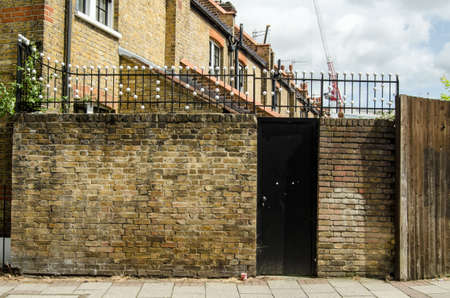 Unusual railings on Webber Street, Southwark, London.  The design of the Victorian railings is a mystery with some thinking the white balls refer to musical notes, others thinking they might be a coded message.の写真素材