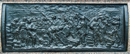 Bronze frieze depicting the Siege of Sevastopol, part of the Crimean War.  Sculpted in 1904 by Henry Price and on public display on the plinth of Queen Victoria's statue at Sandhurst Military Academy, Berkshire.のeditorial素材