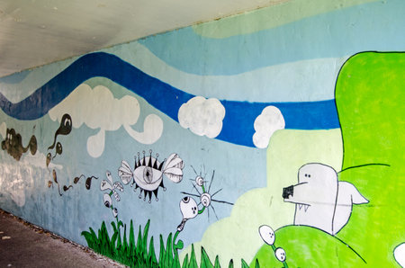 Basingstoke, UK - July 24, 2019: Mural of a fantasy dreamscape decorating the pedestrian subway beneath Viables Roundabout in Basingstoke.のeditorial素材