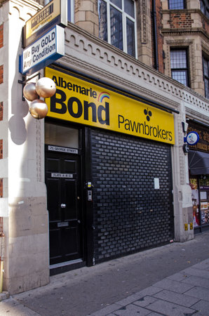 London, UK - October 2, 2019:  Shuttered pawnbrokers shop from the Albermarle Bond chain closed after the company went bust.  Street in Croydon, South London.のeditorial素材