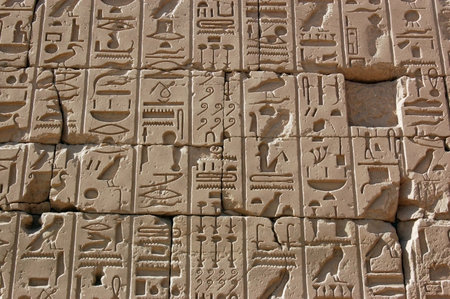 Hieroglyphs carved into stone at the Temple of Karnak in Luxor, Egypt.