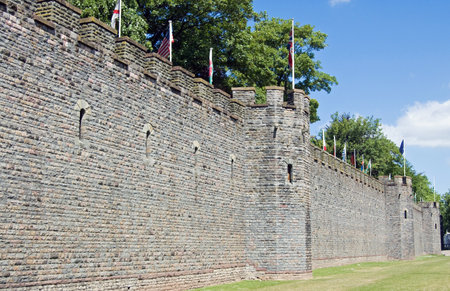 Tall wall surrounding Cardiff Castle in the centre of the Welsh Capital City on a sunny summer day.のeditorial素材