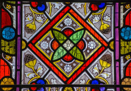 A Victorian stained glass window with a geometric pattern. On public display for over 100 years.