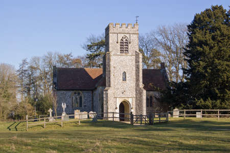 The historic church of Farleigh Wallop near Basingstoke in Hampshire on a sunny Spring day.  The nearby village was destroyed in the Civil War so the church stands alone.の写真素材