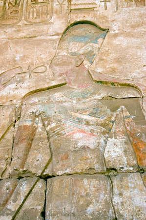 A painted hieroglyphic carving of the Ancient Egyptian Pharoah Ramses II. OUter wall of the Temple...
