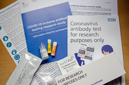 Basingstoke, UK - May 13, 2021: Equipment and paperwork for an NHS COVID-19 antibody test.  Part of...