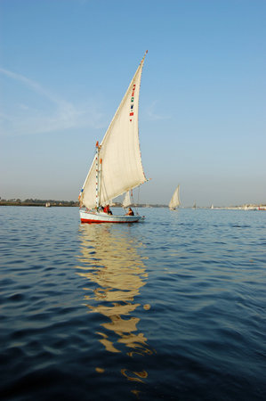 Luxor, Egypt - January 6, 2006: Tourists enjoying a relaxing felucca ride on the River Nile at Luxor, Egypt.のeditorial素材