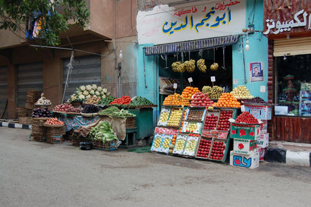 Luxor, Egypt - January 8, 2006:  Fresh fruit and vegetables beautifully displayed outside a greengrocer's shop in the city of Luxor, Egypt.のeditorial素材