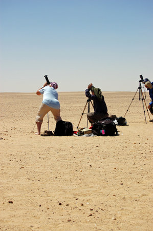 Waw al Kabir, Libya - March 29, 2006: Tourists preparing to observe the total solar eclipse from a remote spot in the Sahara Desert.のeditorial素材