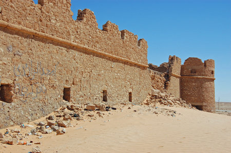 Stone wall and tower at the historic castle at Abu Nujaym in the Sawfajjin district of Libya.  The desert fortress dates back to Roman times and is surrounded by inhospitable landscape.のeditorial素材