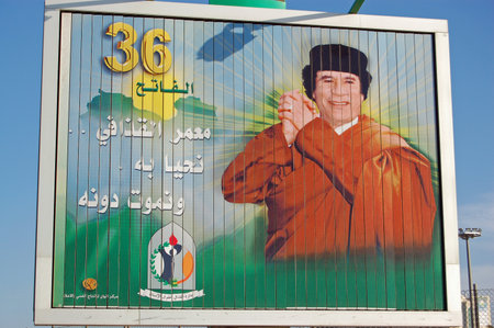 Tripoli, Libya - April 3, 2006: Large billboard poster showing a celebrating President Colonel Gaddifi marking the anniversary of his military coup.のeditorial素材
