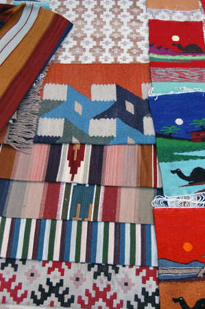 Hand woven woolen carpets for sale in the bazaar of old Tripoli, Libya.の写真素材