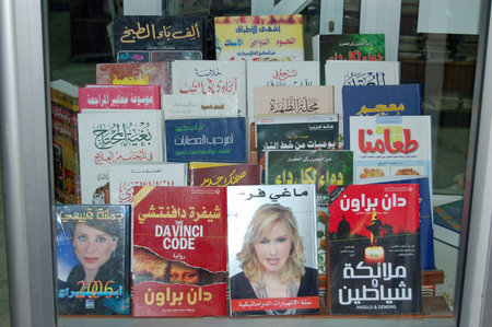 Tripoli, Libya - April 3, 2006: Books by thriller writer Dan Brown and others on display in the window of a book store in Tripoli, Libya.のeditorial素材