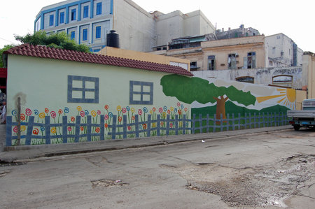 Havana, Cuba - November 12, 2006: A pretty painted mural of a garden and fence on the side of a building in OLd Havana, Cuba.のeditorial素材