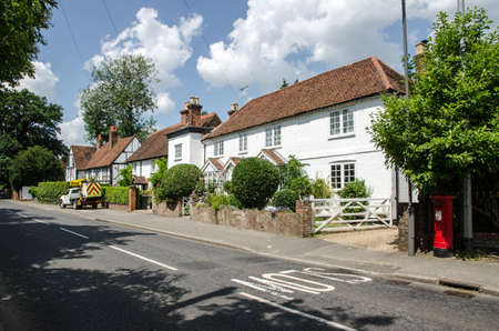 Historic buildings in the village of Well End in Buckinghamshire on a sunny summer afternoon.の写真素材