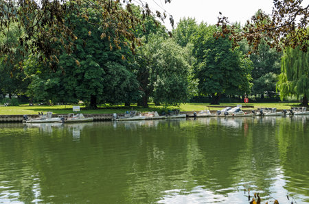 Cookham Dean, UK - July 19, 2021: Small pleasure boats moored on the River Thames at the Berkshire village of Cookham Dean on a sunny Summer afternoon.のeditorial素材