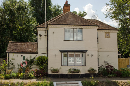 Marlow, UK - July 19, 2021: View from the River Thames of the Lock Keeper's cottage at Marlow Lock in Buckinghamshire.のeditorial素材