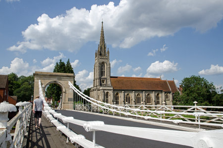 Marlow, UK - July 19, 2021:  View of the landmark All Saints Church from the historic suspension...