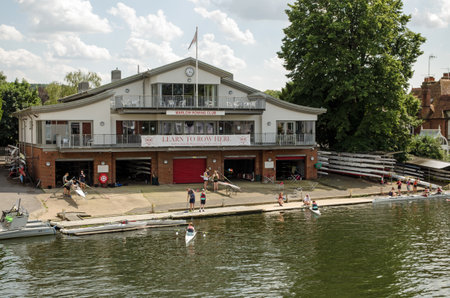 Marlow, UK - July 19, 2021: Students and instructors enjoying lessons on the River Thames at the Marlow Rowing Club on a sunny summer afternoon in Buckinghamshire.のeditorial素材