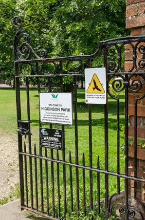 Marlow, UK - July 19, 2021: Sign warning about red kites at Higginson Park in Marlow, Buckinghamshire.  The birds of prey eat carrion and occasionally picnics.のeditorial素材