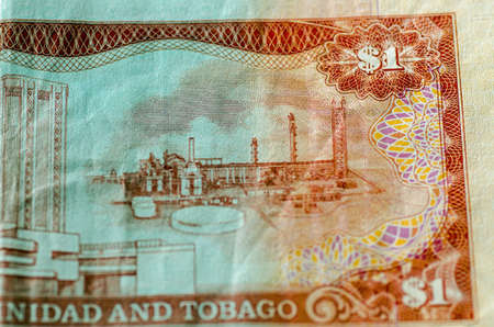 Detail of a used one dollar banknote from Trinidad and Tobago showing the anhydrous ammonia plant of...