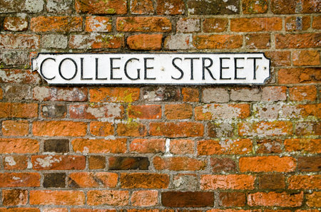A cast iron road sign for College Street in Winchester, Hampshire.  Space for copy.の写真素材