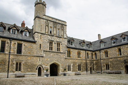 An historic courtyard at the public school Winchester College in Hampshire on an overcast summer...