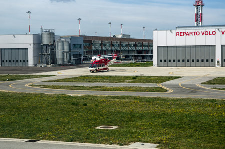 Venice, Italy - April 19, 2-22: A helicopter used by the emergency services on an apron at Marco Polo Airport on a sunny morning in Venice.のeditorial素材