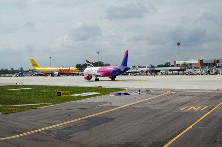 Venice, Italy - April 19, 2022:  A busy morning at Marco Polo Airport, Venice with aircraft operated by Whizz Air, DHL and British Airways.のeditorial素材