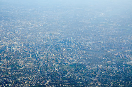 Aerial view across central London looking north from the districts of Stockwell, Elephant and Castle, Bermondsey and Southwark across the River Thames towards the City of London and Whitechapel.の写真素材