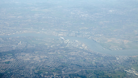 Aerial view of the River Thames as it flows between Belvedere, Abbey Wood, Dagenham and Coldharbour - industrial districts of East London on a sunny Spring morning.の写真素材
