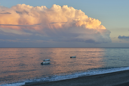 beach and boats at sunsetの写真素材