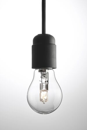 Bulb and power cord with a gray backgroundの写真素材