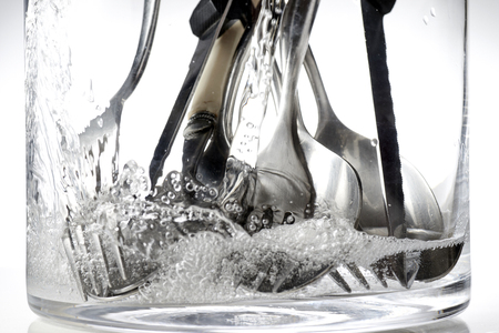 washing of cutlery with water jetの写真素材