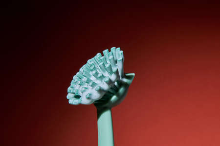 Detail of brush for washing dishes and dishes on redの写真素材