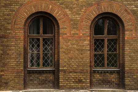 grunge wooden windows on brick wall old windows on the brick wallの写真素材
