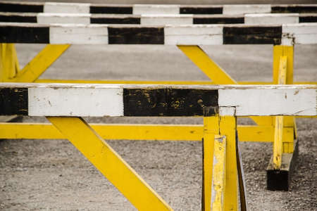 A hurdle race on gray running in stadium trackの写真素材