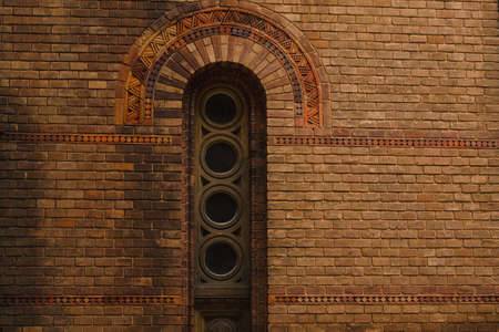 grunge wooden window on brick wall old windows on the brick wall in Chernivtsi Universityの写真素材