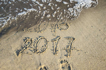 Inscription on wet sand Summer 2016. Concept photo of summer vacation.の写真素材