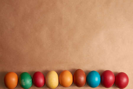 Colorful Easter eggs brown background close-up happy esternの写真素材