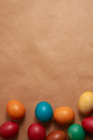 Colorful Easter eggs on brown background close-upの写真素材
