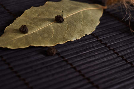 bay leaf on a style black wooden backgroundの写真素材