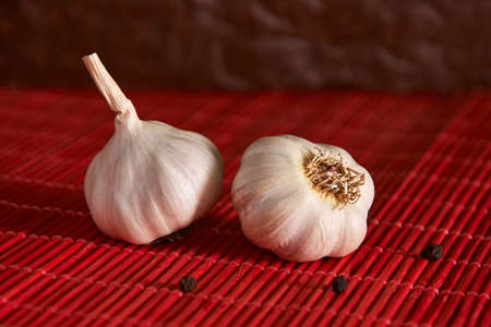 Garlic, black pepper on a wooden table. Garlics. sliced garlic, garlic clove, garlic bulb