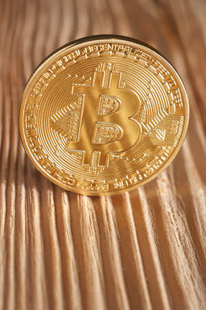 Golden bitcoin on wooden background. Bitcoin crypto currency, Blockchain technology, digital moneyの写真素材