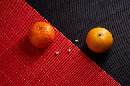 Delicious and beautiful Tangerines. Peeled Tangerine orange and Tangerine orange slices on a Dark...