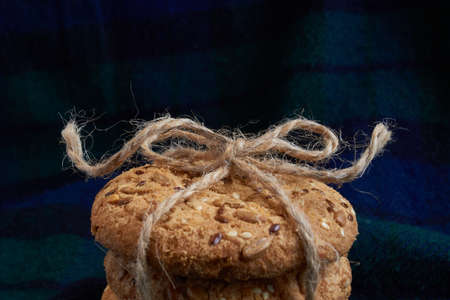 homemade oat cookies with sunflower seeds on blue backgroundの写真素材
