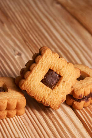 Chocolate cookies on gray plate on wooden table