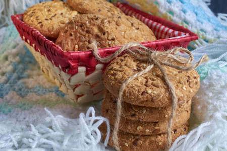 Savory cookies sprinkled with sesame seeds, sunflower on plaid