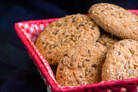 Savory cookies sprinkled with sesame seeds, sunflower on plaidの写真素材
